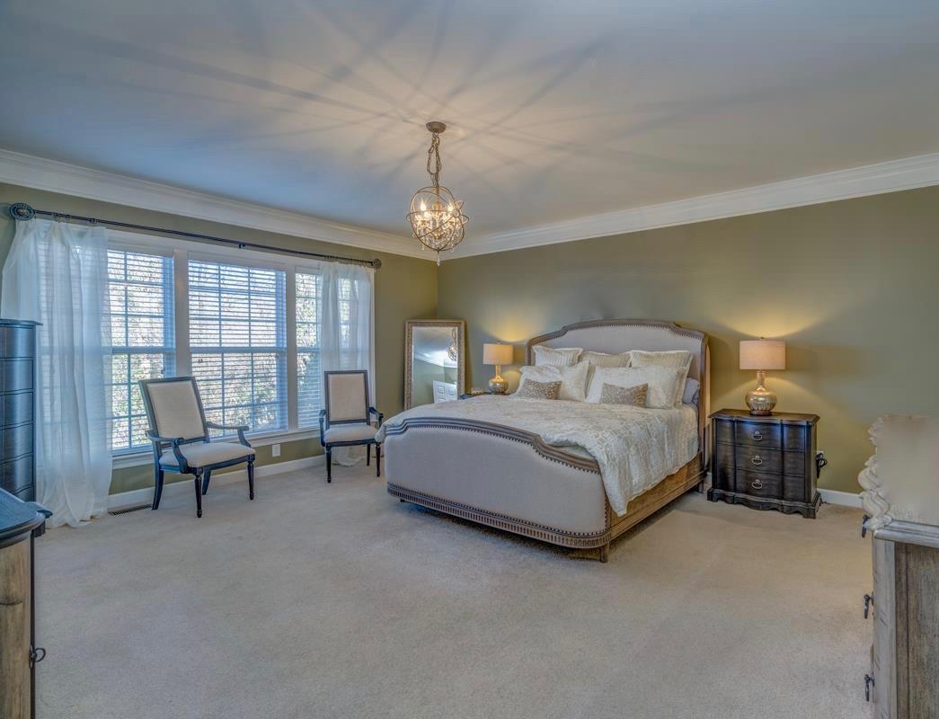 3537 Trimble Road Nashville, TN 37215 - Photo 6 of 29 a bedroom with a large bed and a chandelier