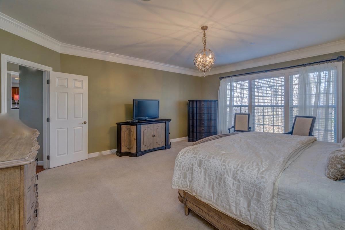 3537 Trimble Road Nashville, TN 37215 - Photo 7 of 29 a spacious bedroom with a bed and a large window