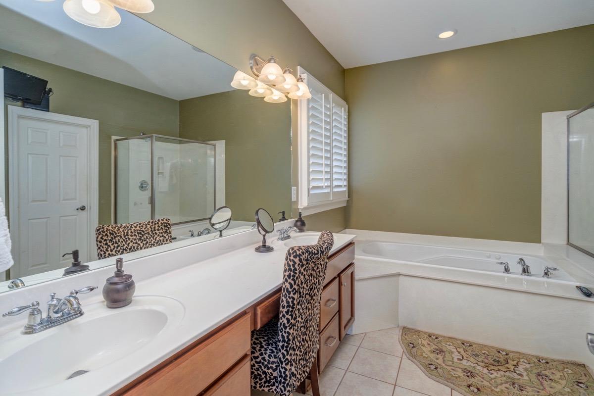 3537 Trimble Road Nashville, TN 37215 - Photo 8 of 29 a bathroom with a tub sink and mirror