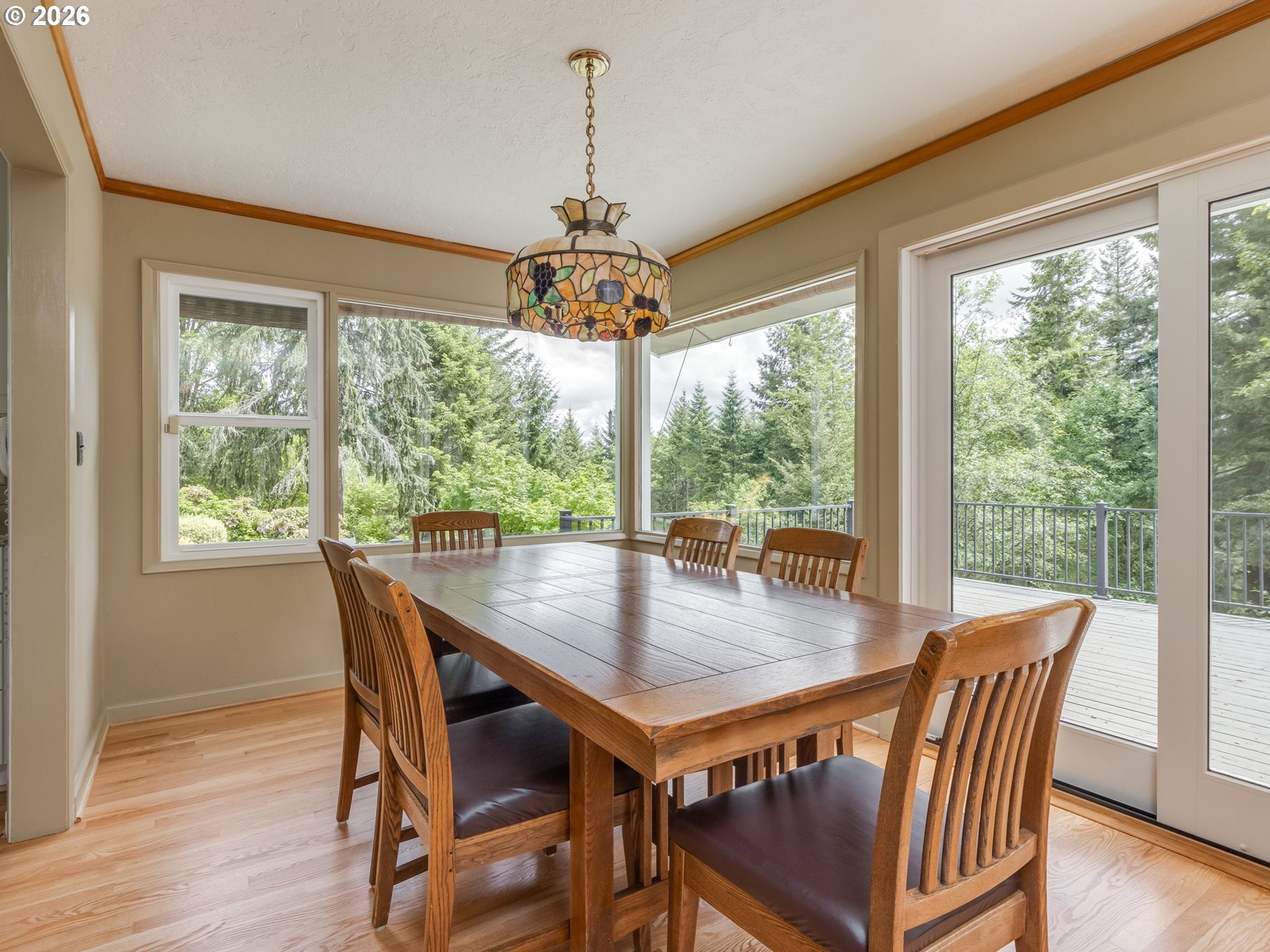 48140 Southeast Linhart Butte Road Sandy, OR 97055 - Photo 14 of 47 a view of a dining room with furniture window and wooden floor