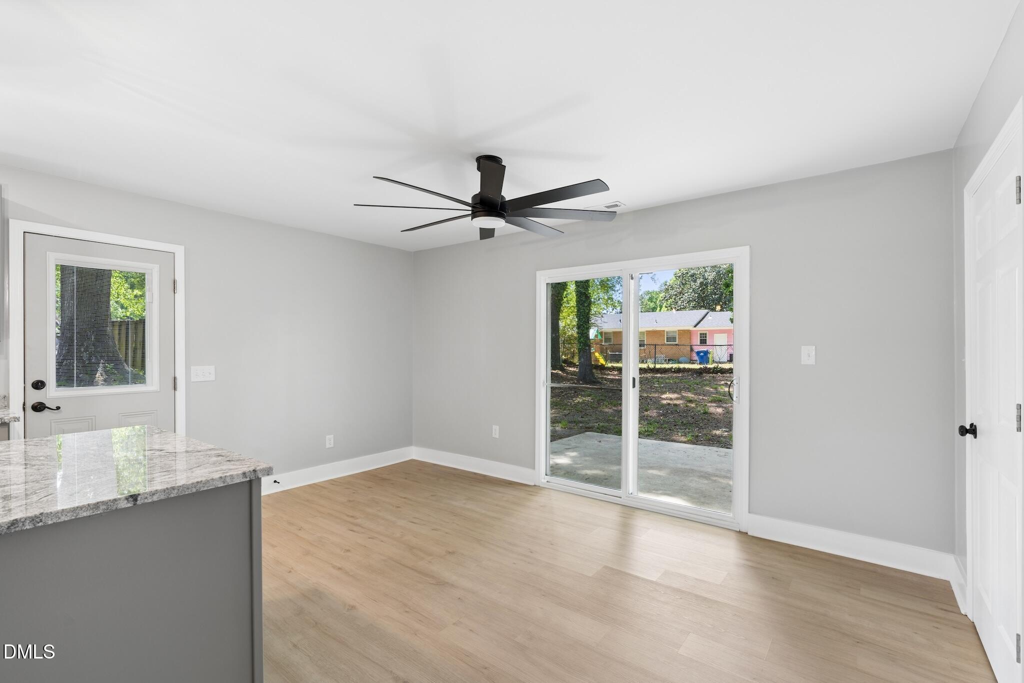 1200 Armstrong Circle Raleigh, NC 27610 - Photo 10 of 28 a view of a livingroom with a ceiling fan and wooden floor