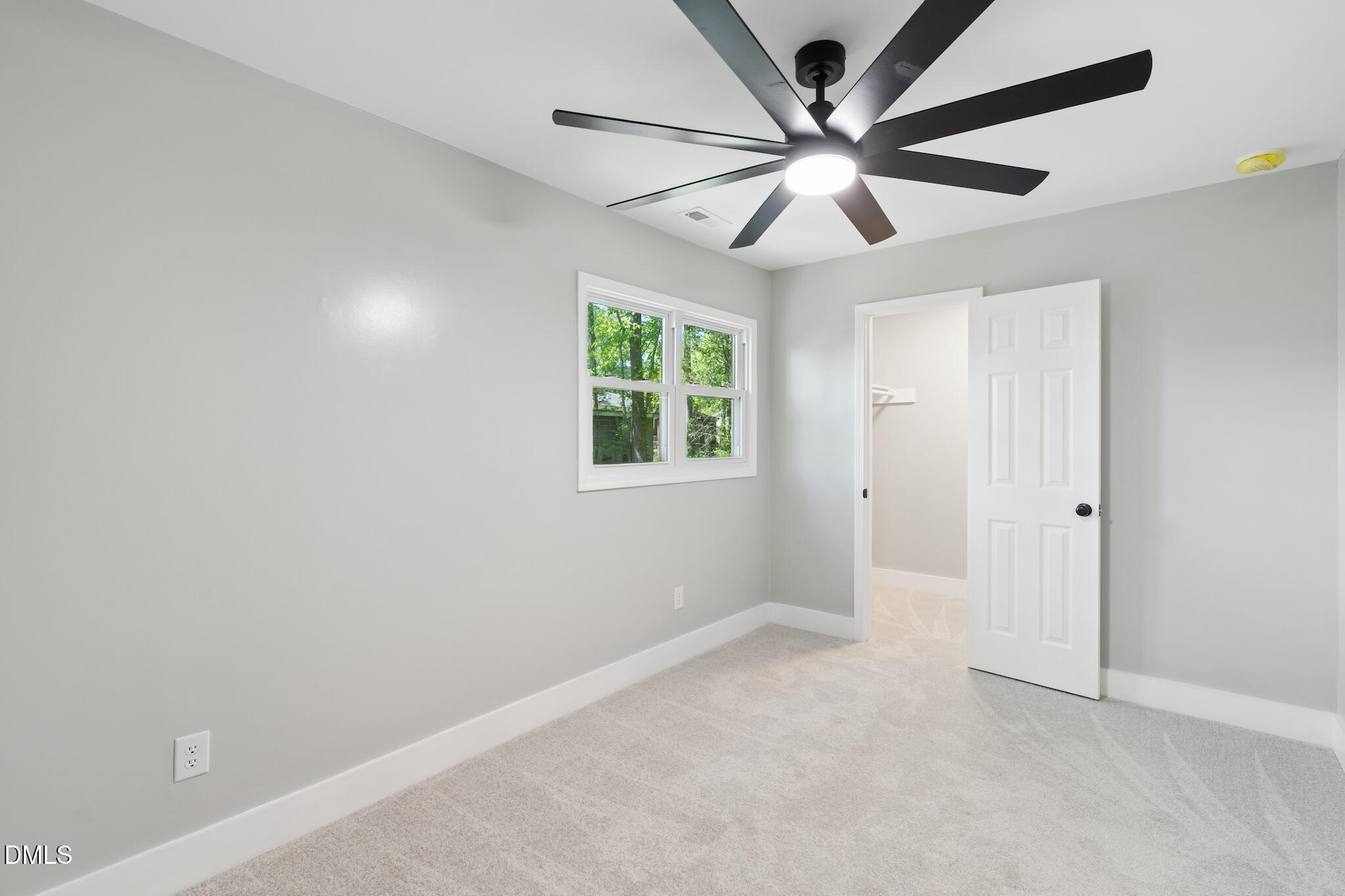 1200 Armstrong Circle Raleigh, NC 27610 - Photo 12 of 28 an empty room with windows and ceiling fan