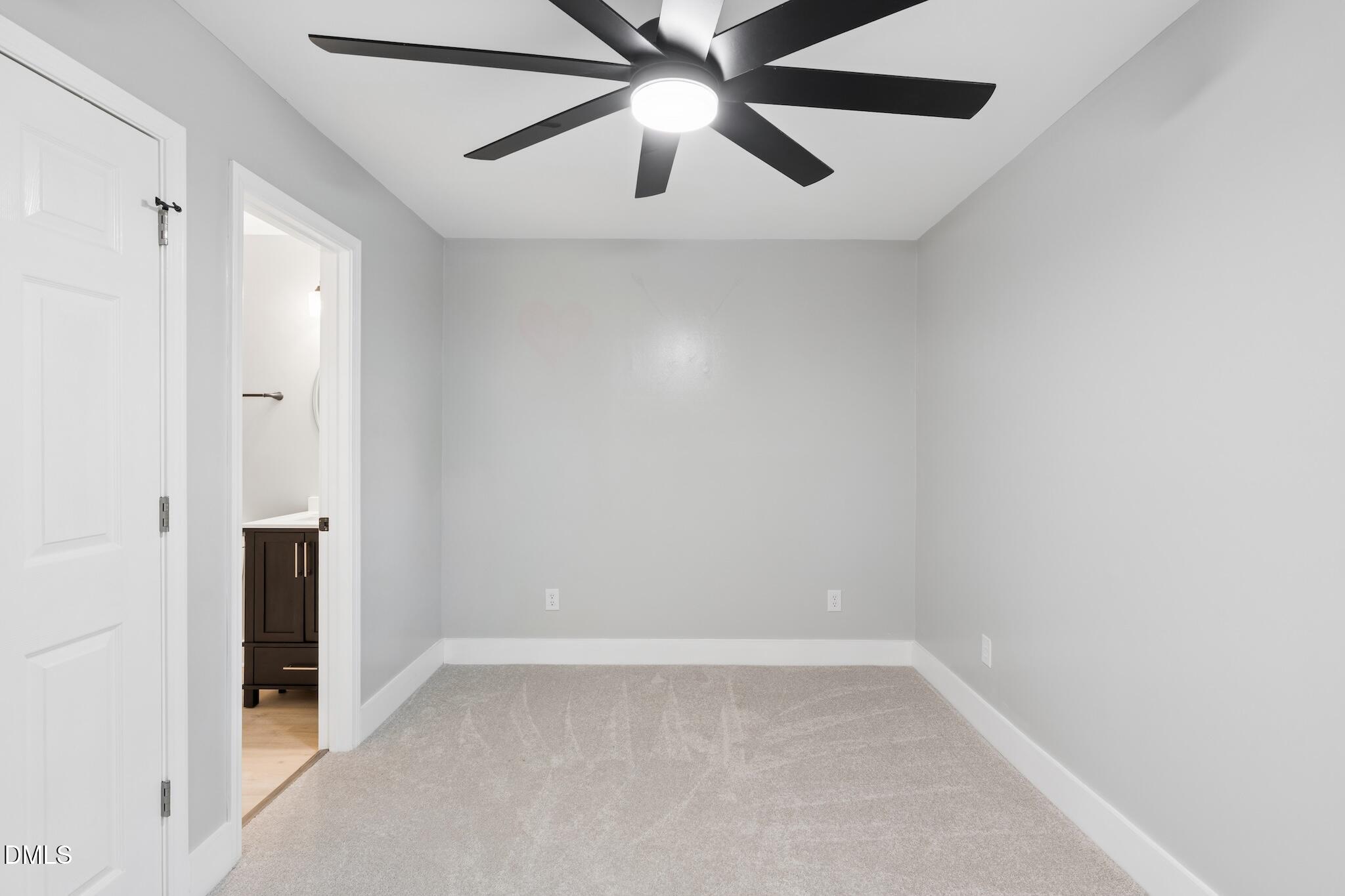 1200 Armstrong Circle Raleigh, NC 27610 - Photo 13 of 28 an empty room with closet and a chandelier fan