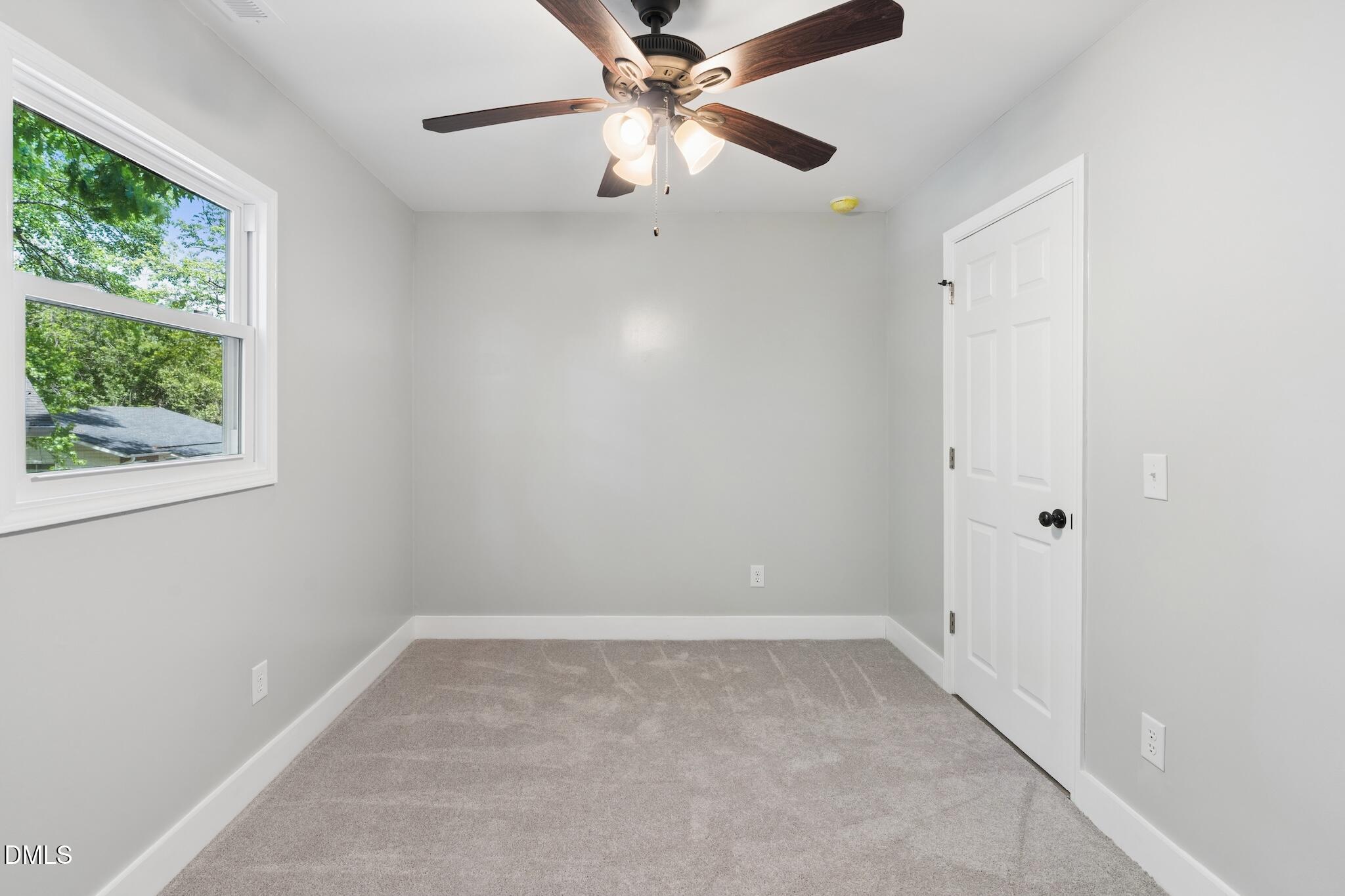 1200 Armstrong Circle Raleigh, NC 27610 - Photo 15 of 28 an empty room with a window and a fan