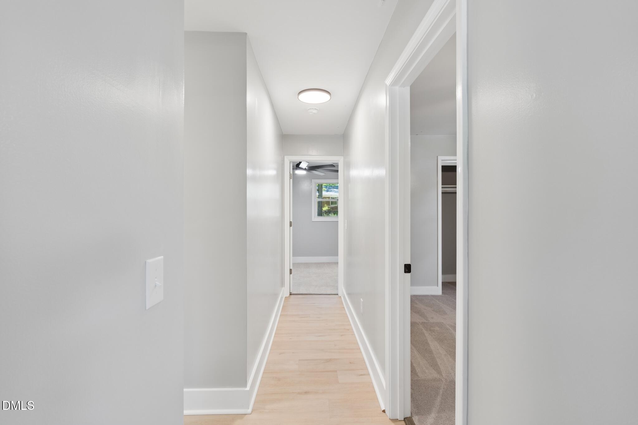 1200 Armstrong Circle Raleigh, NC 27610 - Photo 17 of 28 a view of a hallway with wooden shelves