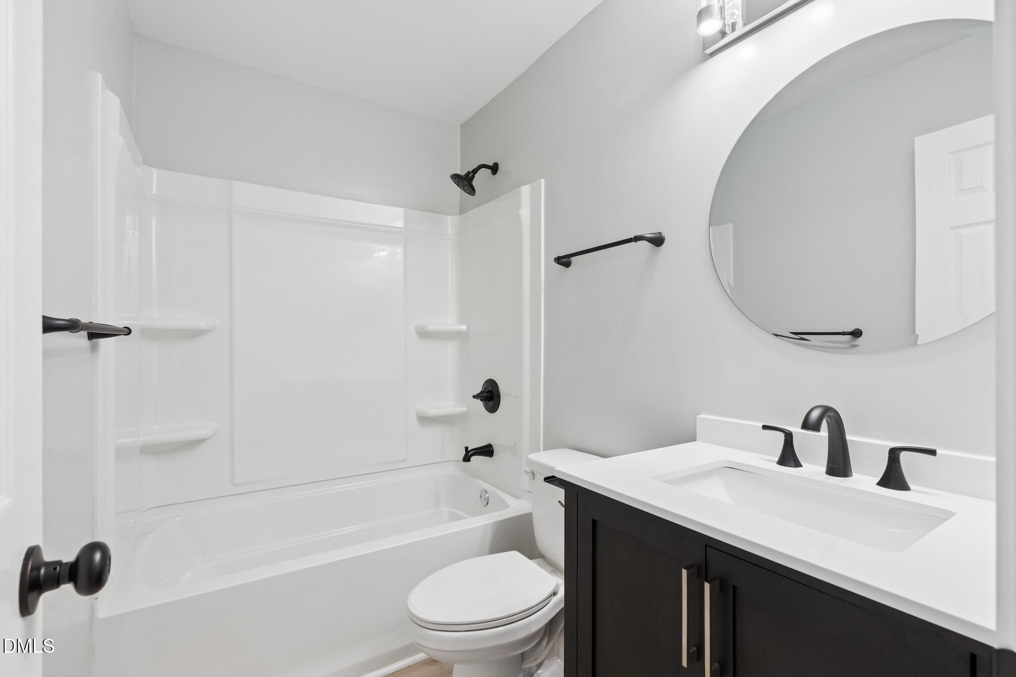 1200 Armstrong Circle Raleigh, NC 27610 - Photo 18 of 28 a bathroom with a sink a toilet and shower