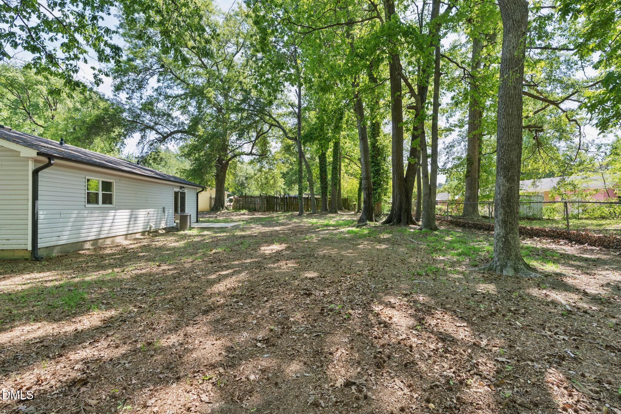 1200 Armstrong Circle Raleigh, NC 27610 - Photo 24 of 28 a view of a house with backyard and trees