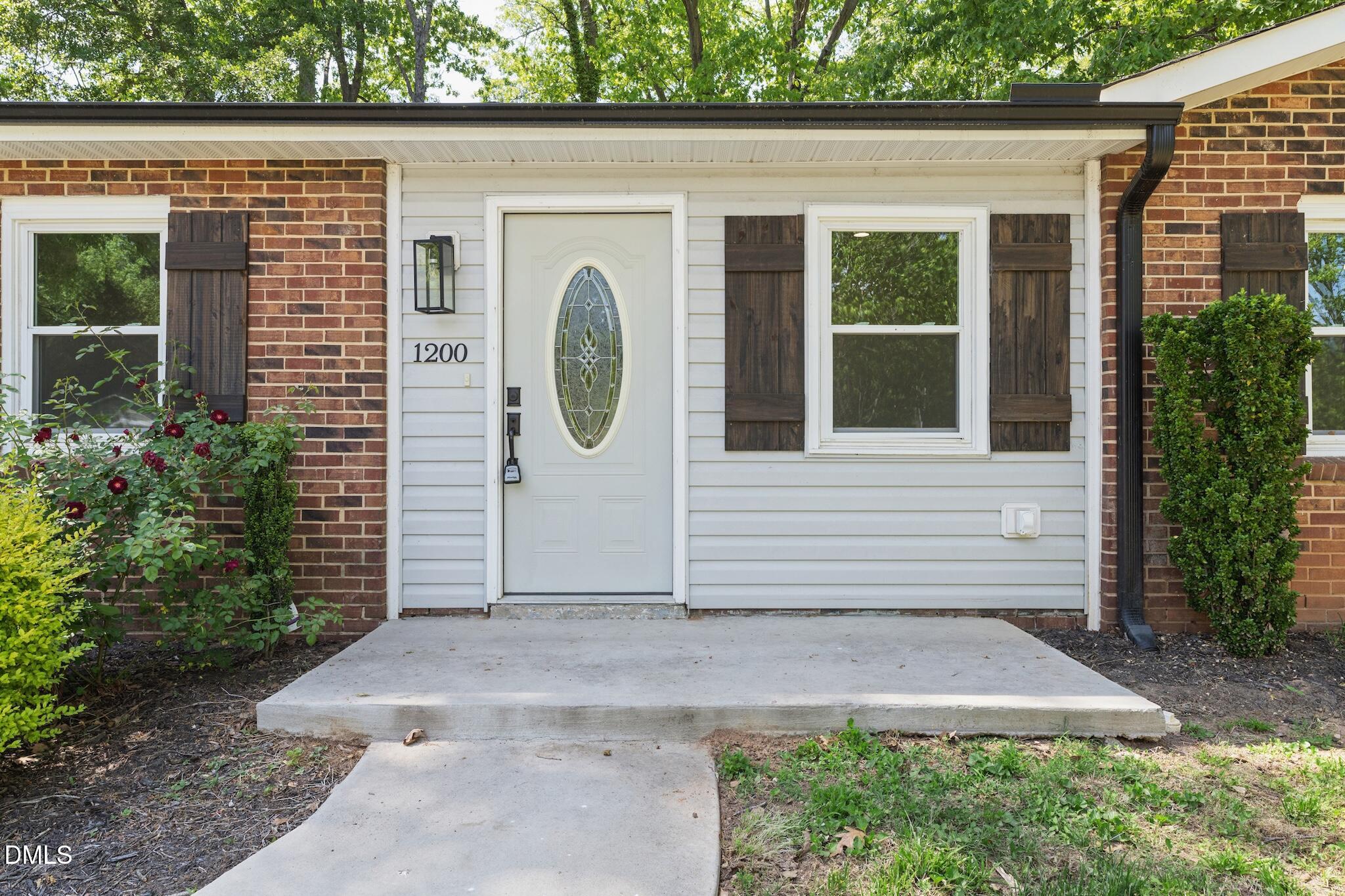 1200 Armstrong Circle Raleigh, NC 27610 - Photo 3 of 28 a front view of a house with garden