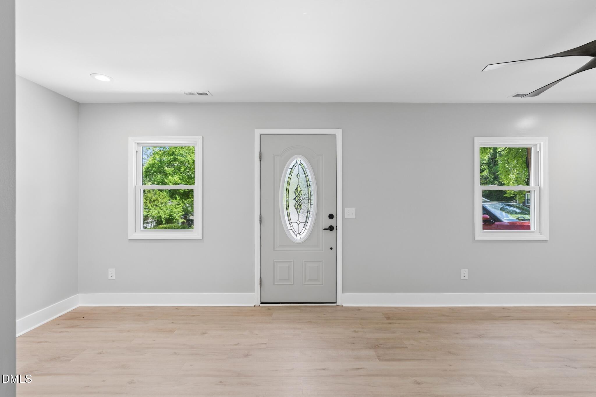 1200 Armstrong Circle Raleigh, NC 27610 - Photo 4 of 28 an empty room with window and wooden floor