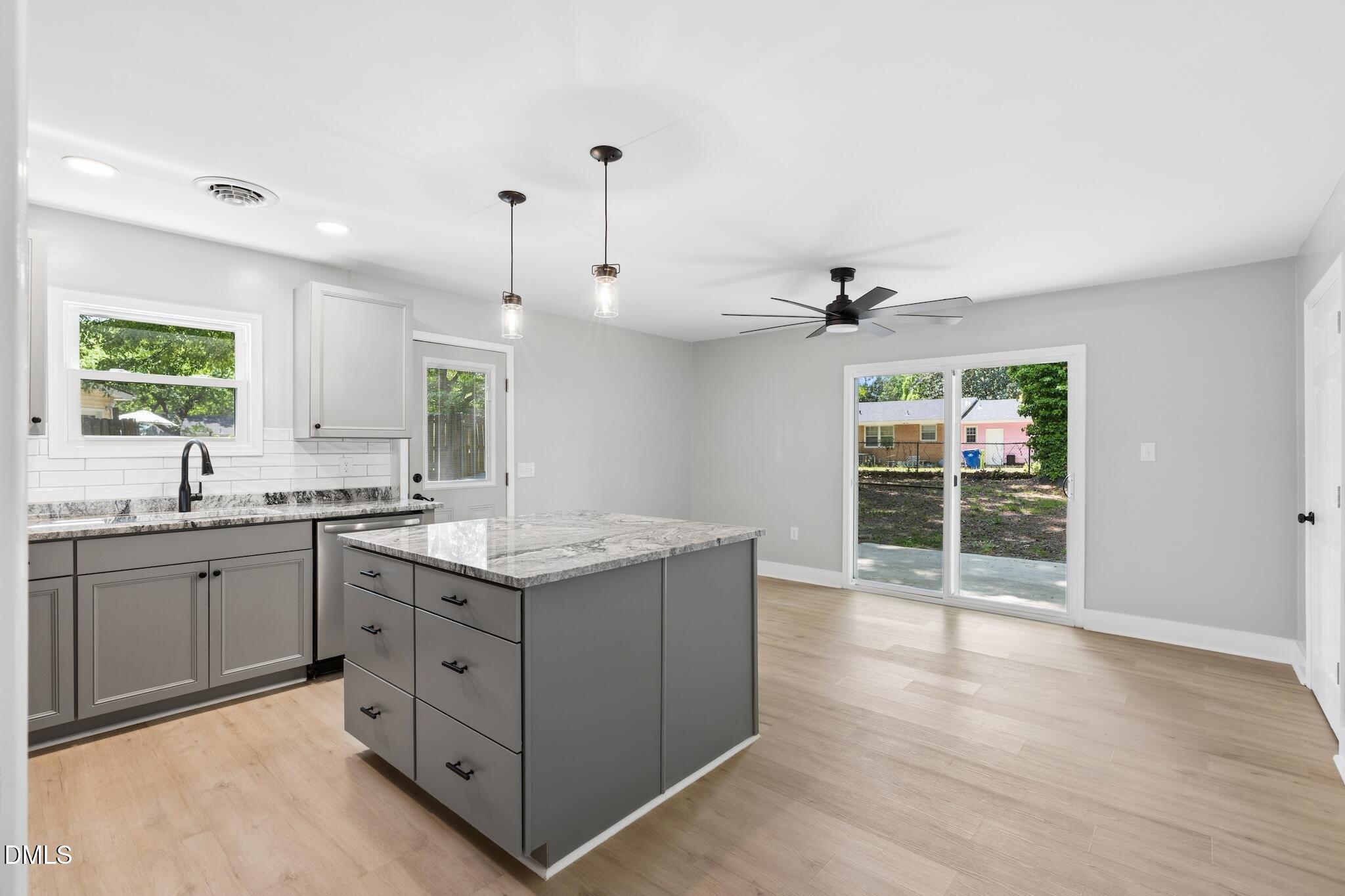 1200 Armstrong Circle Raleigh, NC 27610 - Photo 9 of 28 a kitchen with a sink stove and cabinets