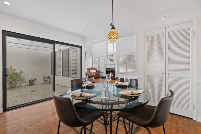 a kitchen with sink a microwave and cabinets