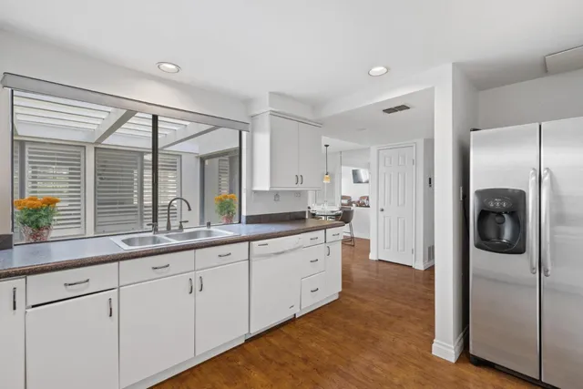 a bedroom with a large bed and a large window
