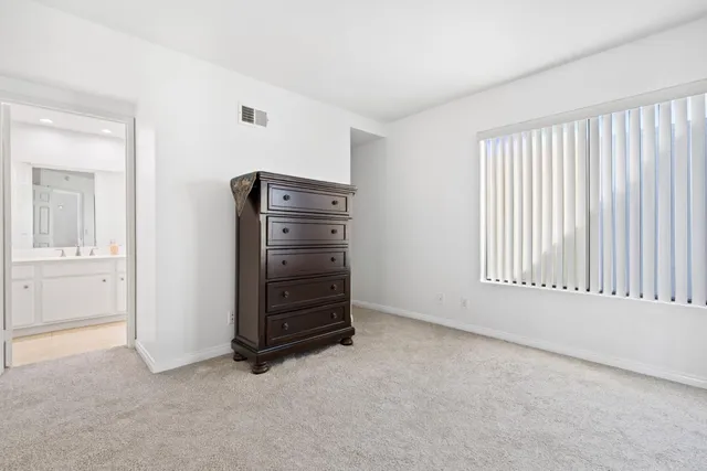 a view of an empty room with a fireplace