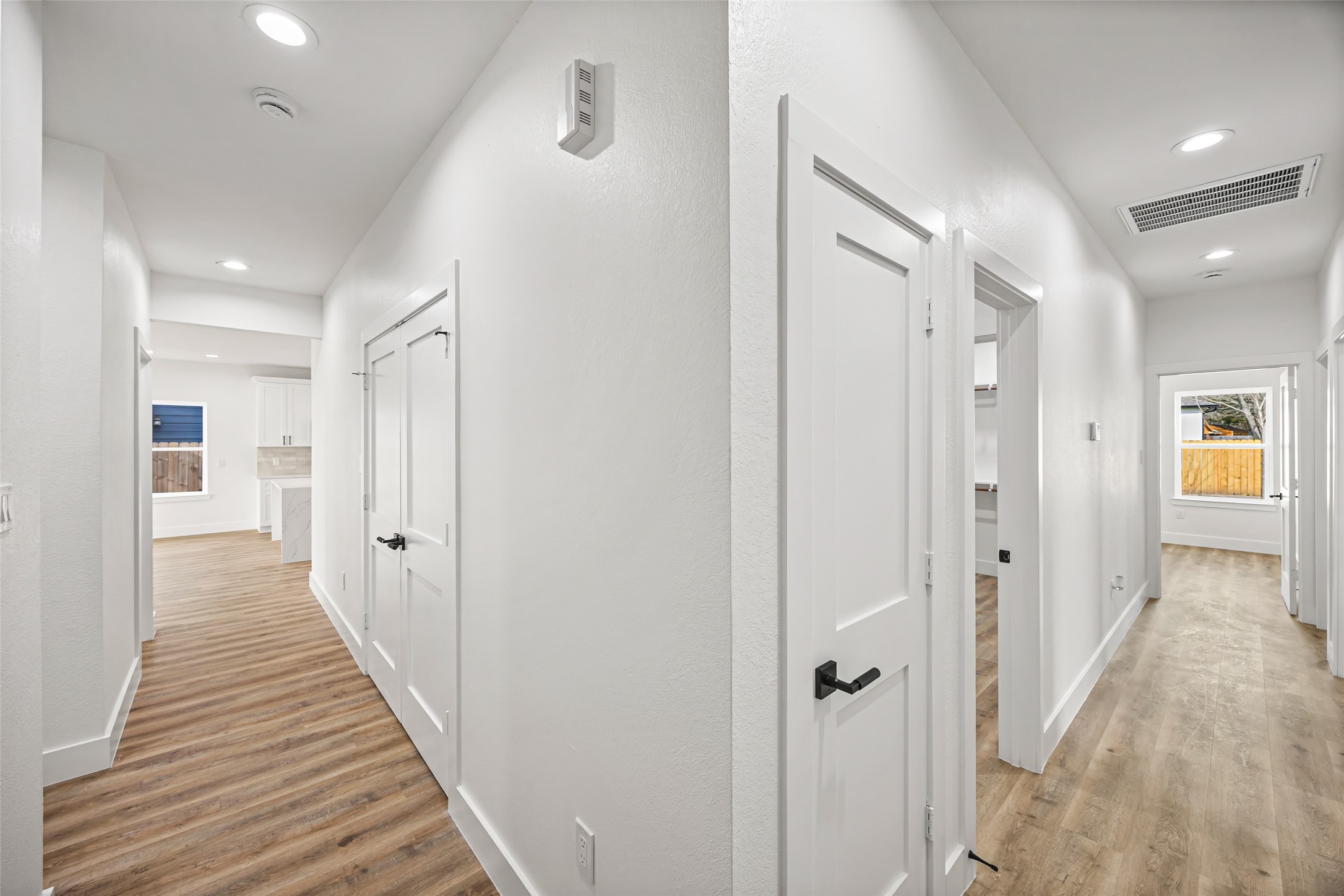 1807 Waco Street Dayton, TX 77535 - Photo 11 of 26 Wide hallway layout providing access to bedrooms and main living areas.