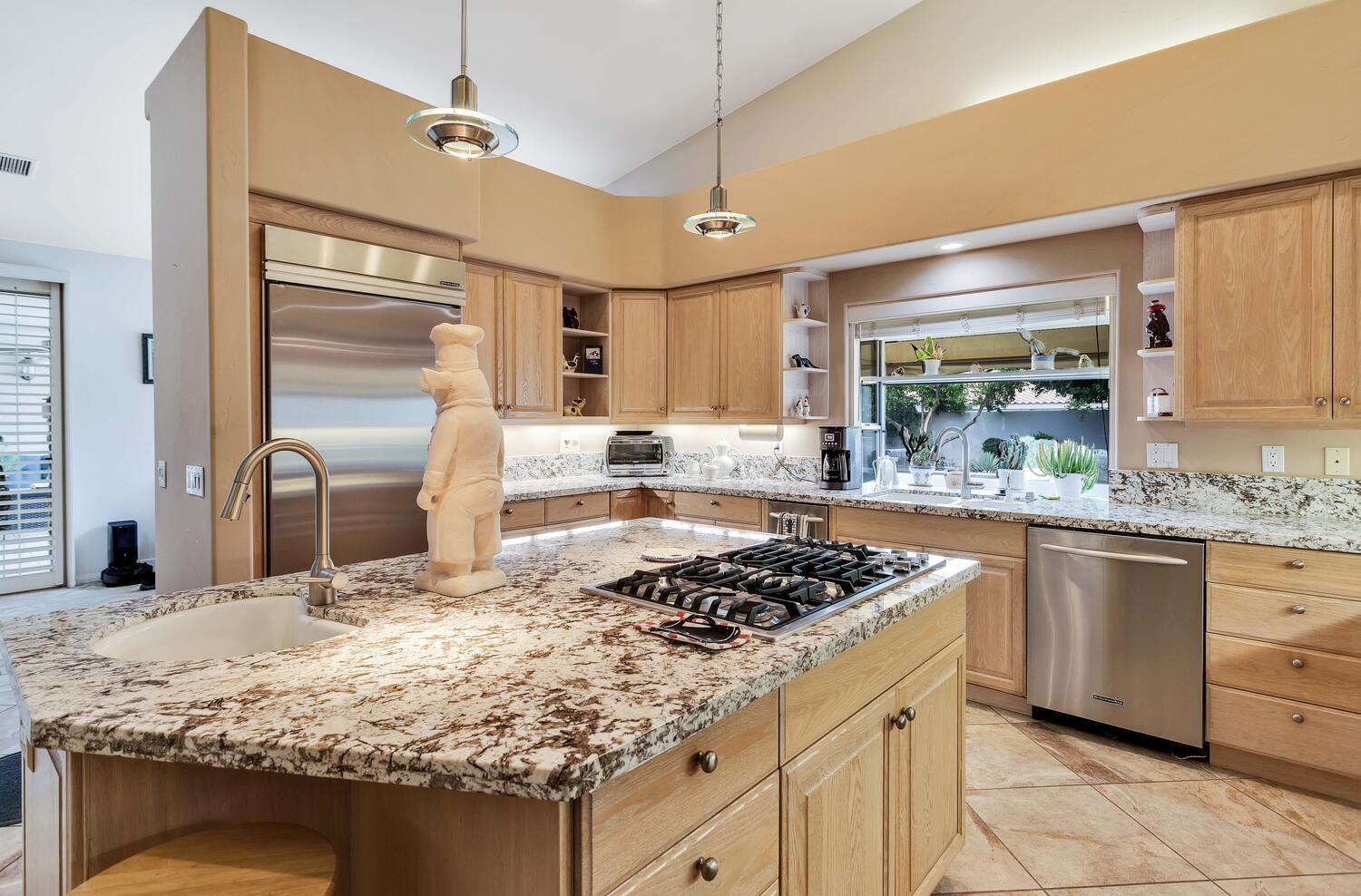 43920 Culebra Lane Bermuda Dunes, CA 92203 - Photo 15 of 66 a kitchen with stainless steel appliances granite countertop sink stove and refrigerator