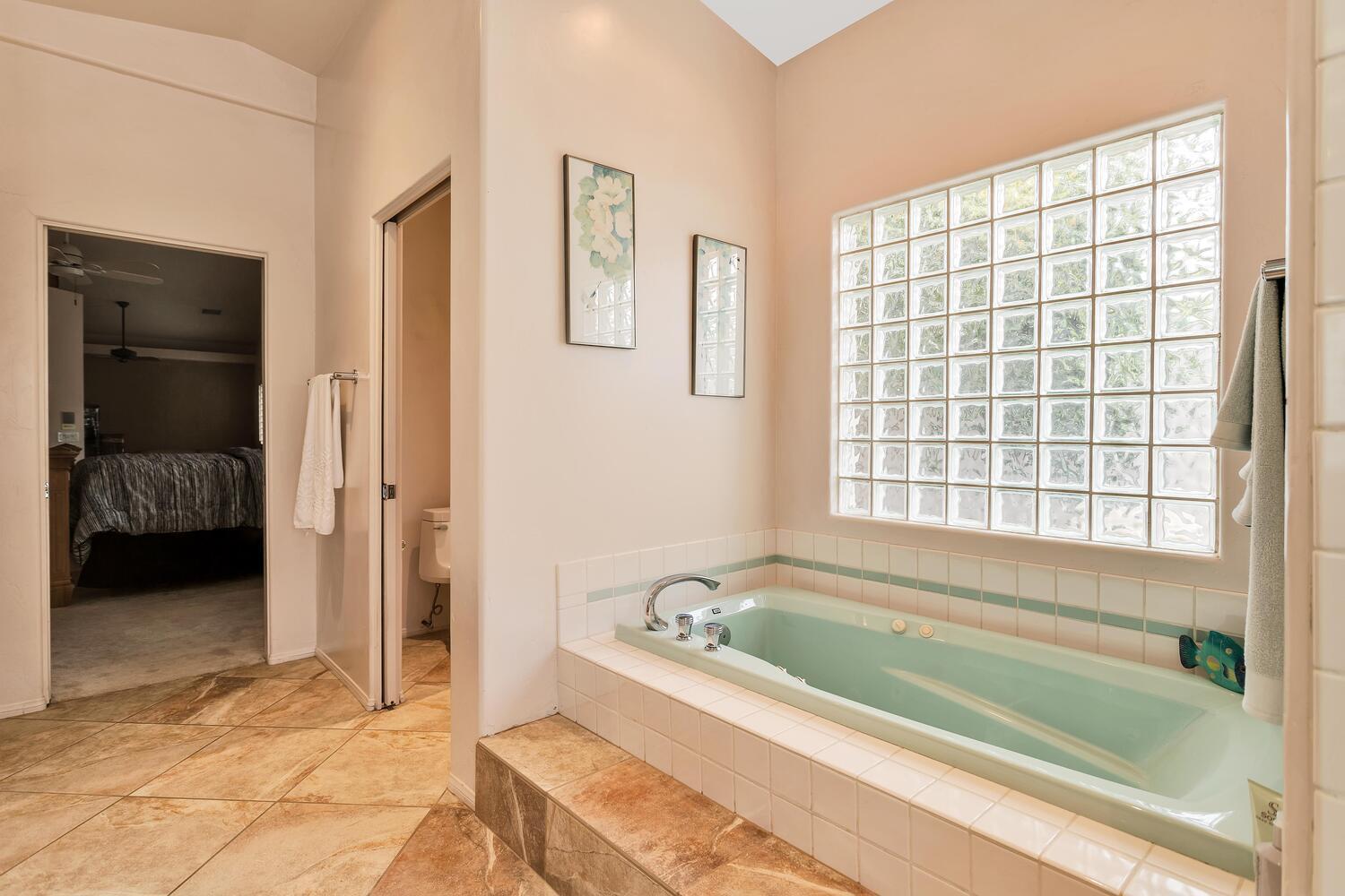 43920 Culebra Lane Bermuda Dunes, CA 92203 - Photo 27 of 66 a bathroom with a bathtub and a shower