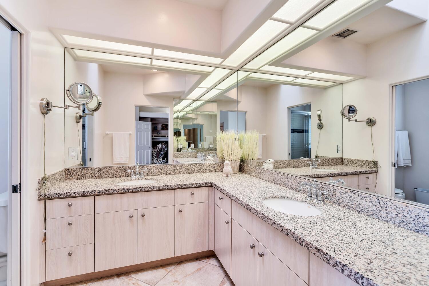 43920 Culebra Lane Bermuda Dunes, CA 92203 - Photo 30 of 66 a bathroom with a granite countertop sink and a mirror