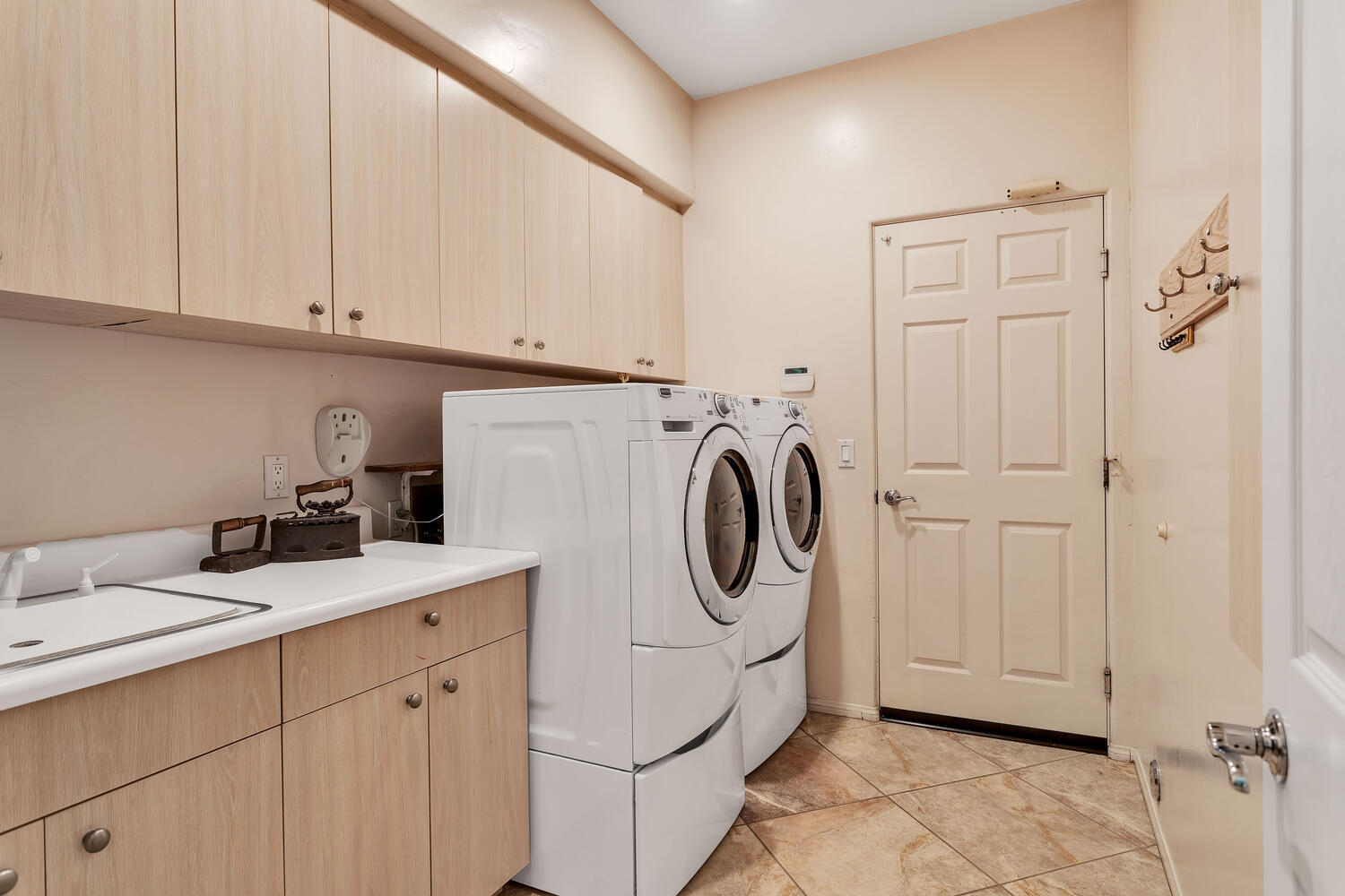 43920 Culebra Lane Bermuda Dunes, CA 92203 - Photo 42 of 66 a utility room with sink dryer and washer