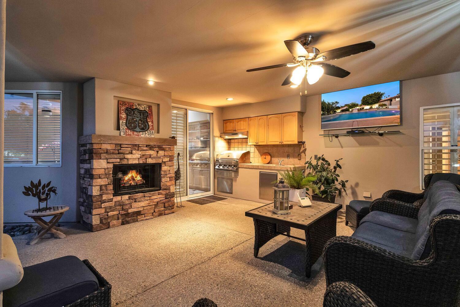 43920 Culebra Lane Bermuda Dunes, CA 92203 - Photo 44 of 66 a living room with furniture and a fireplace