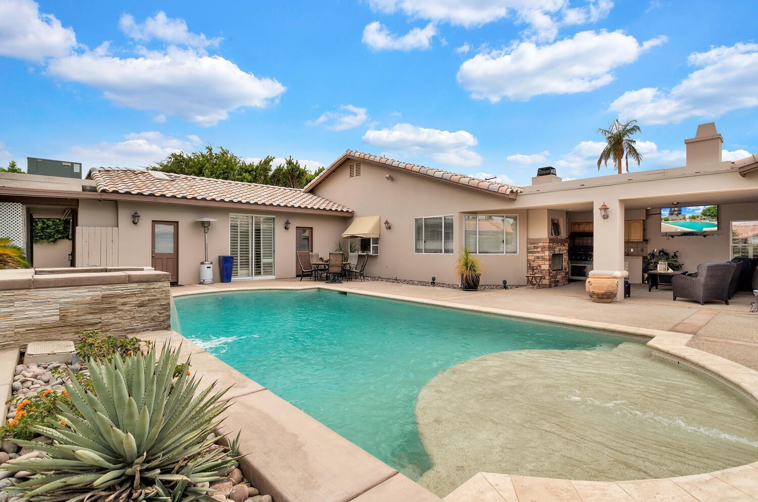43920 Culebra Lane Bermuda Dunes, CA 92203 - Photo 49 of 66 a view of a white house in the back yard