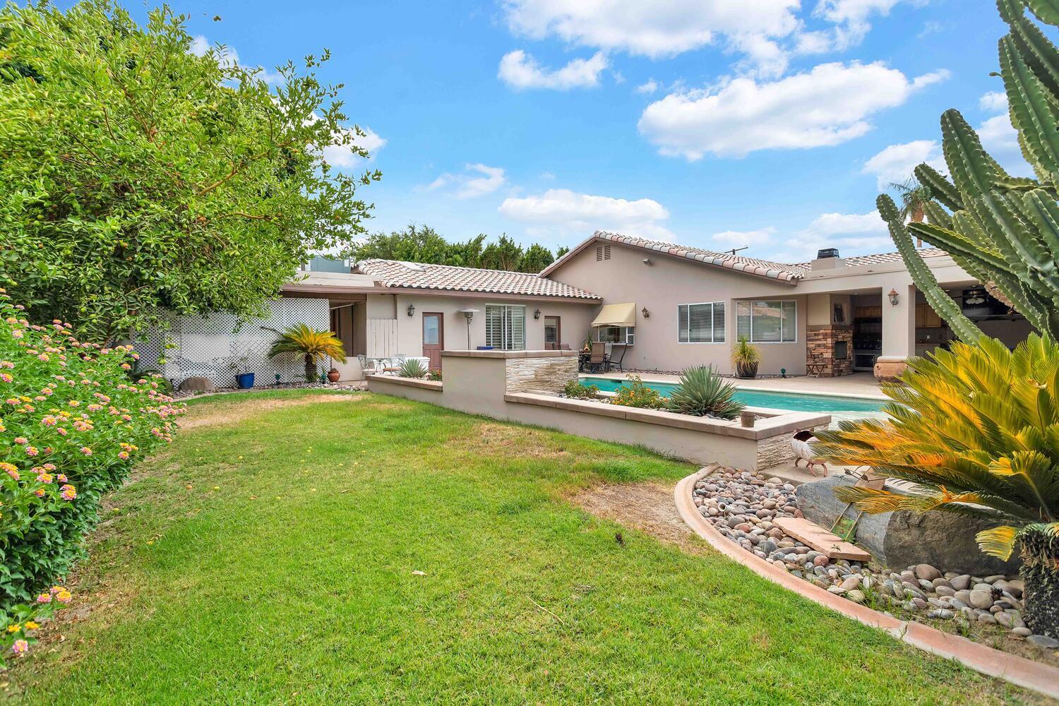 43920 Culebra Lane Bermuda Dunes, CA 92203 - Photo 51 of 66 a front view of a house with swimming pool having outdoor seating