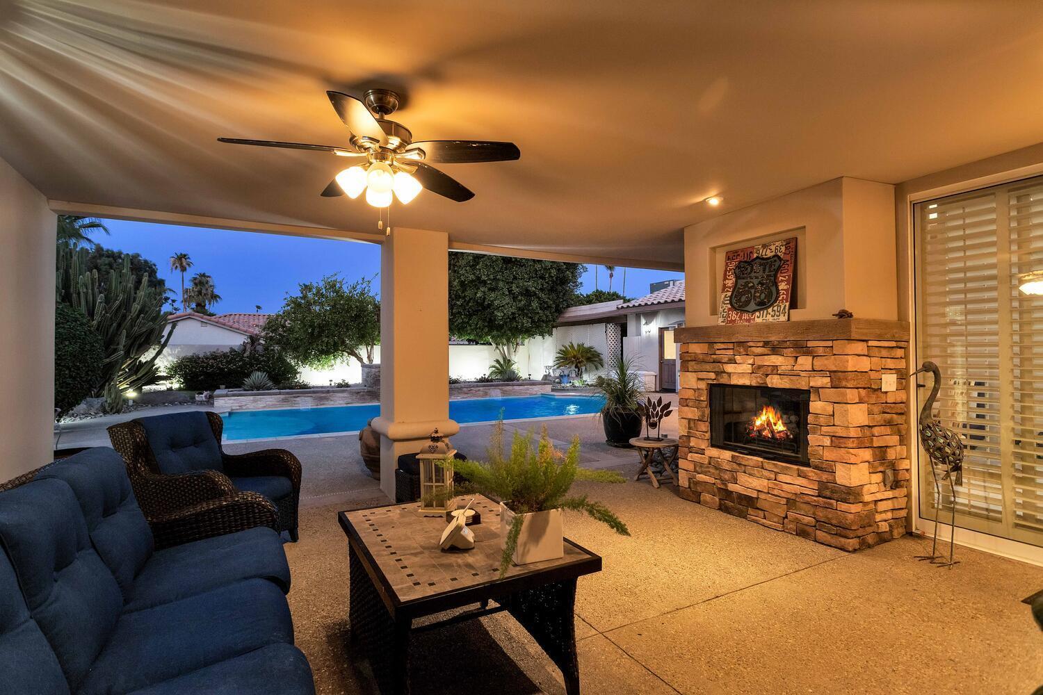 43920 Culebra Lane Bermuda Dunes, CA 92203 - Photo 7 of 66 a living room with furniture a fireplace and a flat screen tv