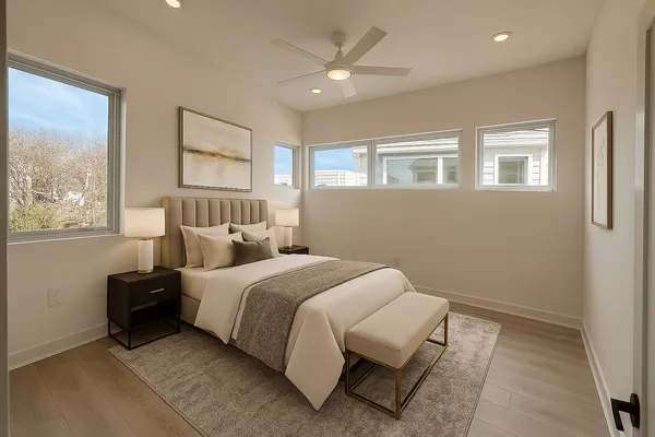 a bed room with a bed and a window