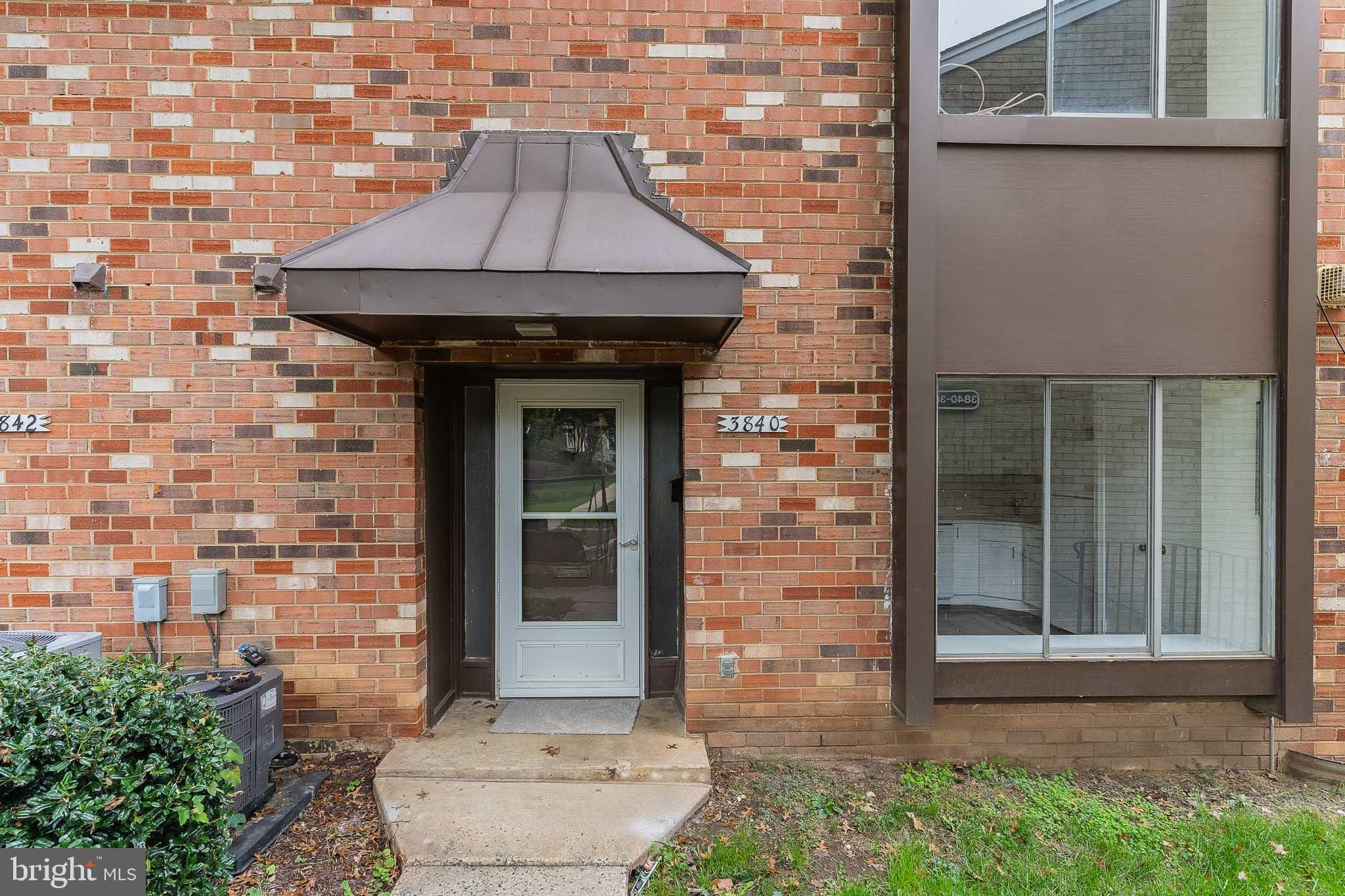 3840 Persimmon Circle Fairfax, VA 22031 - Photo 1 of 25 a front view of a house with a yard