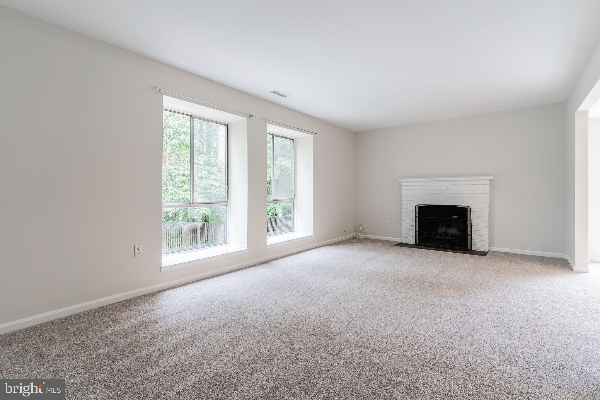 3840 Persimmon Circle Fairfax, VA 22031 - Photo 13 of 25 an empty room with a fireplace and a window
