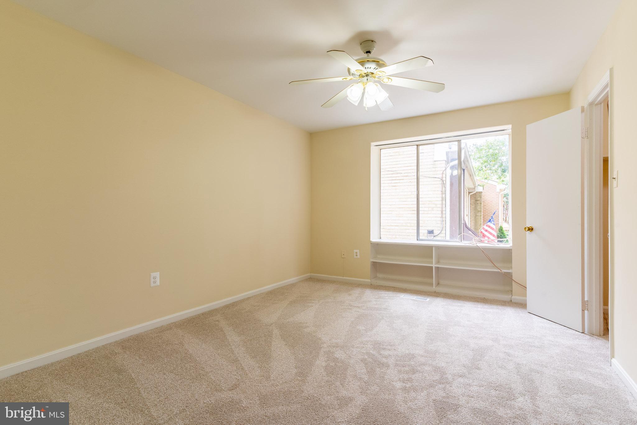 3840 Persimmon Circle Fairfax, VA 22031 - Photo 19 of 25 an empty room with chandelier fan and windows