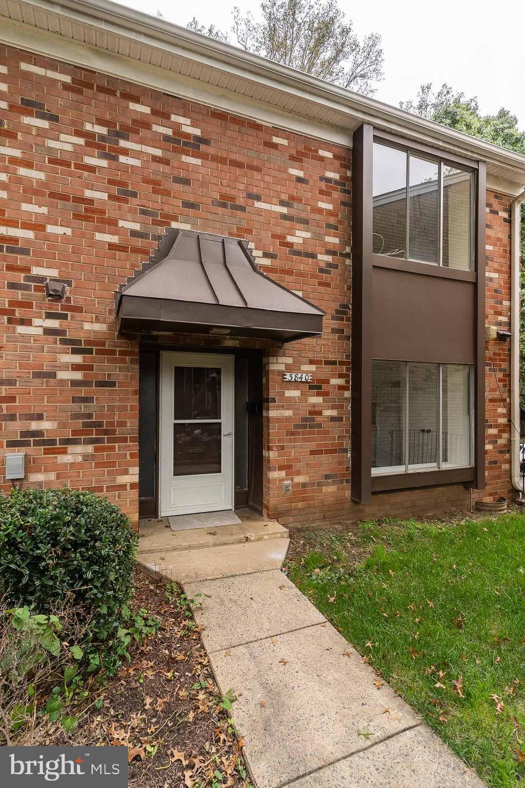 3840 Persimmon Circle Fairfax, VA 22031 - Photo 2 of 25 a front view of a house with garden
