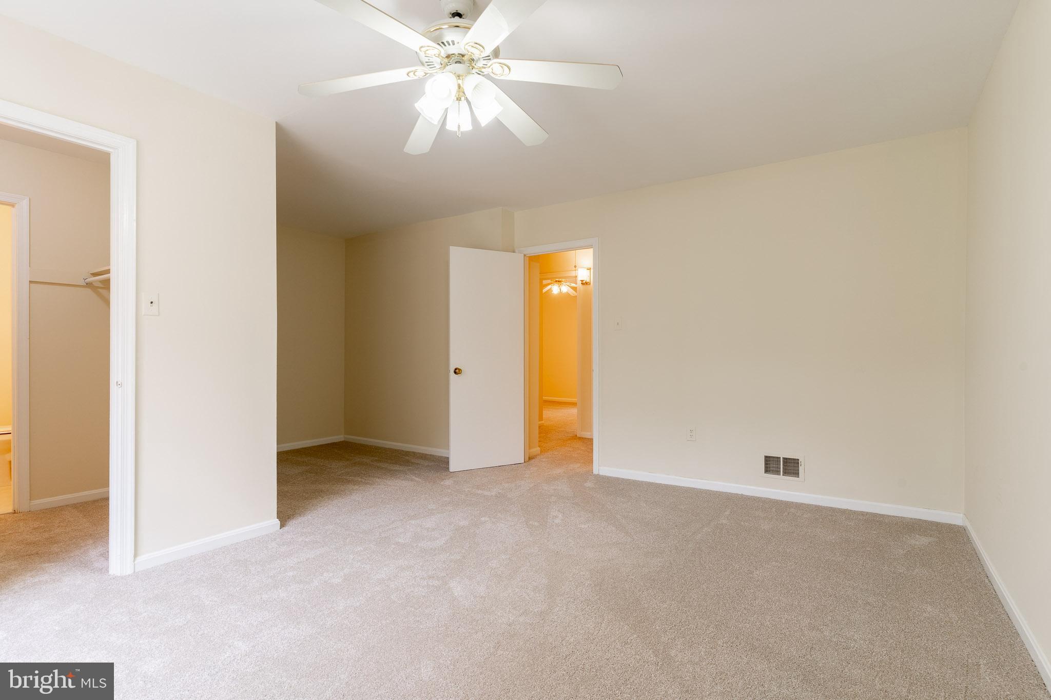 3840 Persimmon Circle Fairfax, VA 22031 - Photo 21 of 25 an empty room with closet and a chandelier fan