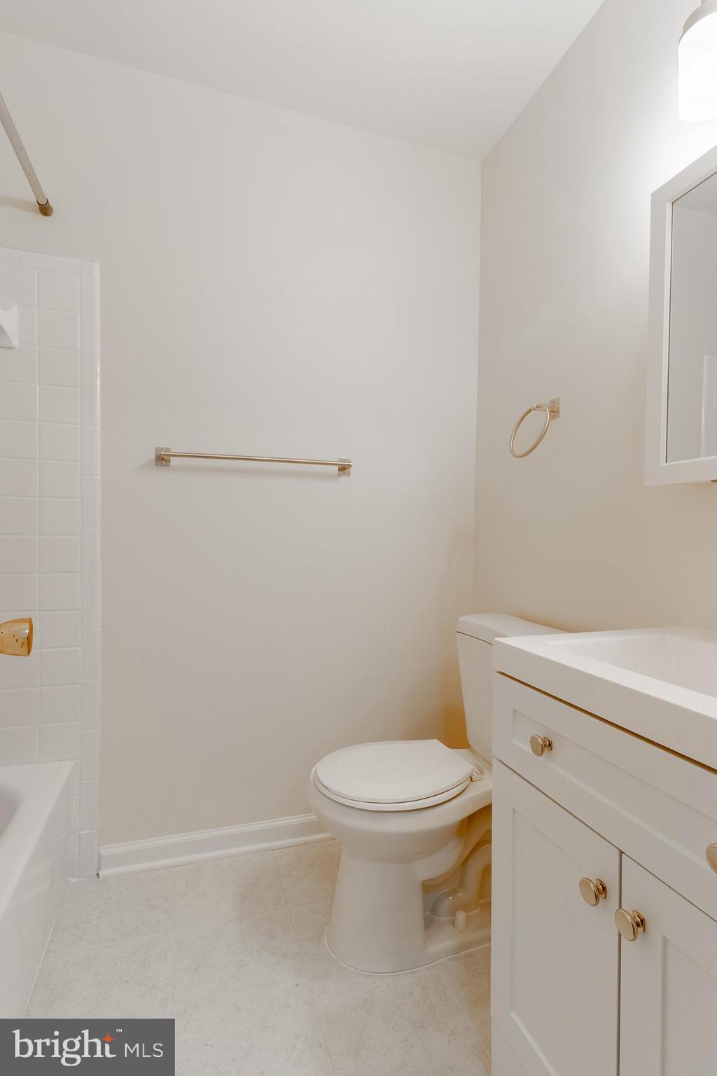 3840 Persimmon Circle Fairfax, VA 22031 - Photo 23 of 25 a white toilet sitting next to a bath tub