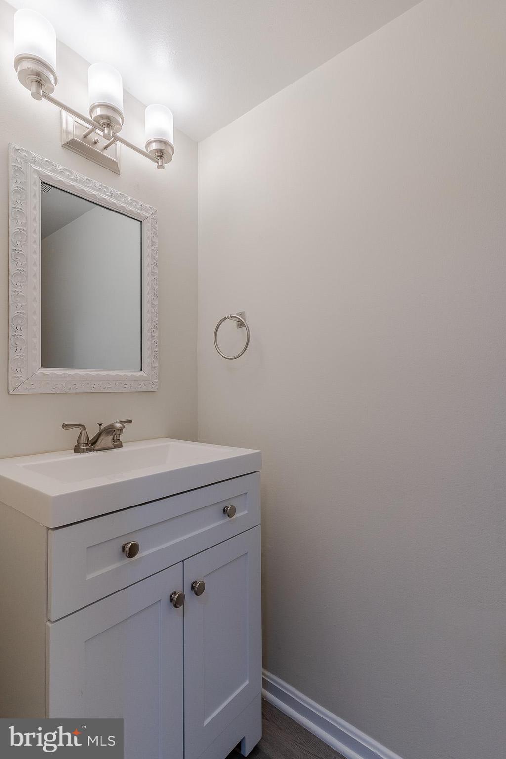 3840 Persimmon Circle Fairfax, VA 22031 - Photo 4 of 25 a bathroom with a sink and a mirror