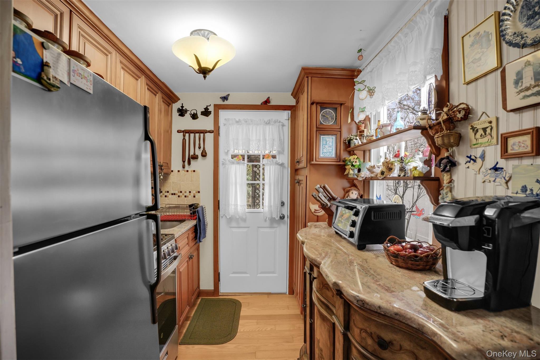 103 Wauwepex Trail Ridge, NY 11961 - Photo 12 of 25 a view of a kitchen with appliances and cabinets