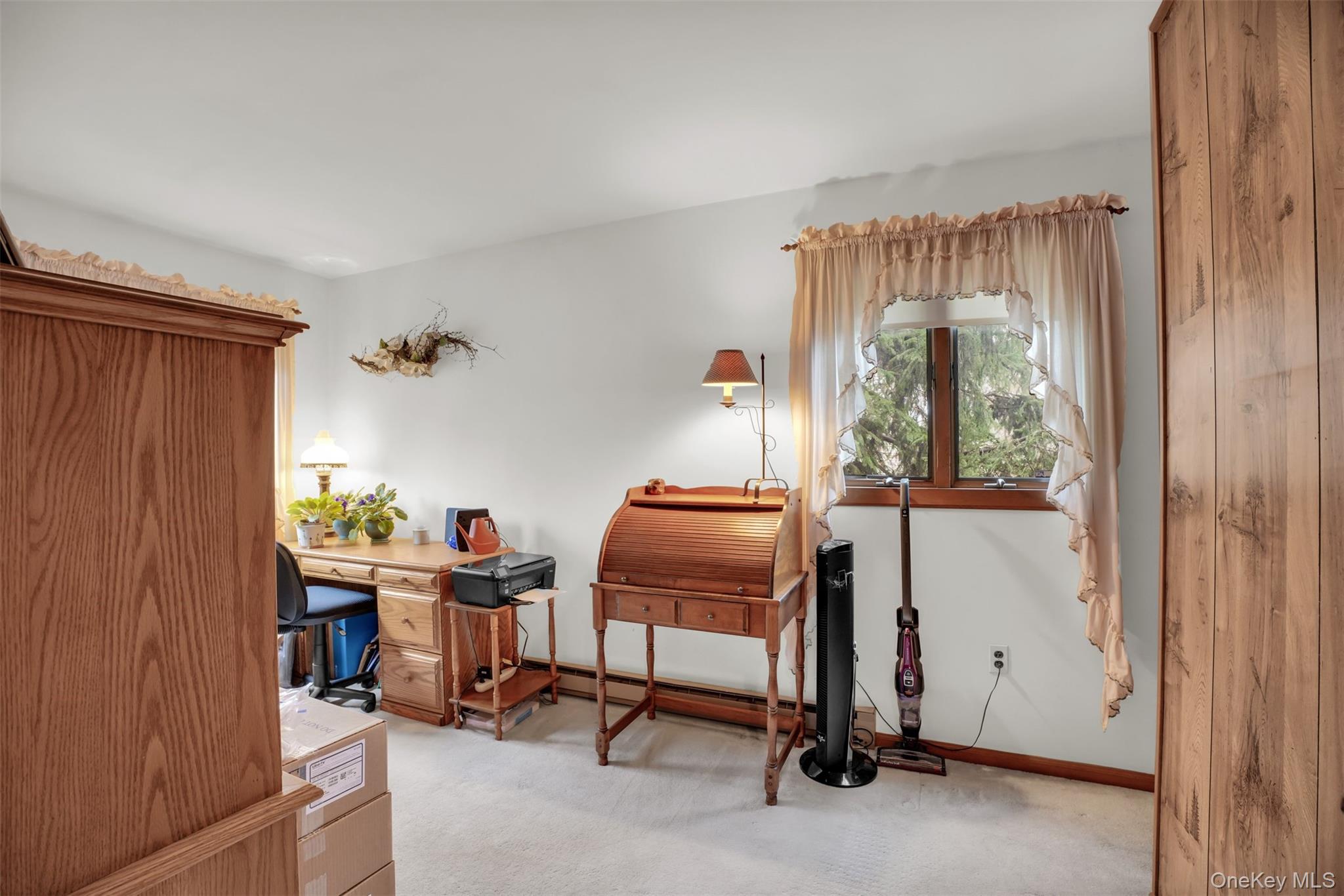 103 Wauwepex Trail Ridge, NY 11961 - Photo 17 of 25 a view of a workspace with furniture and a window