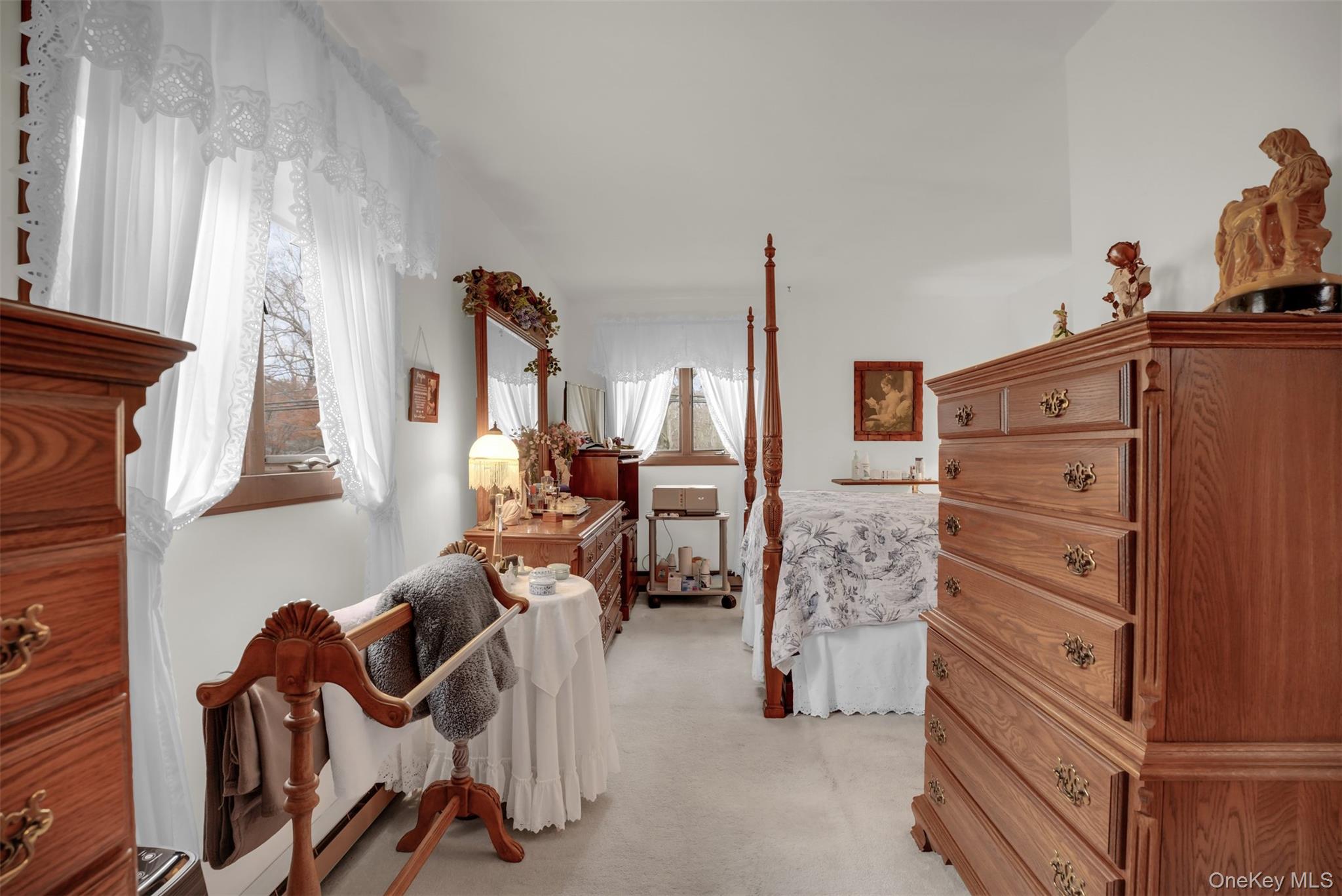 103 Wauwepex Trail Ridge, NY 11961 - Photo 19 of 25 a bed room with a bed and a chair