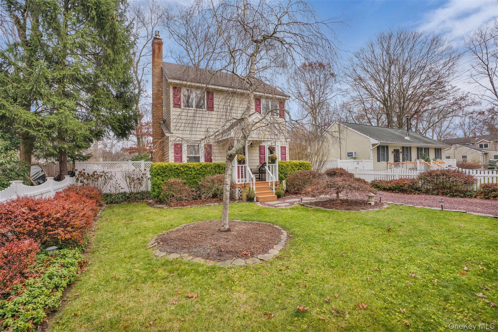 103 Wauwepex Trail Ridge, NY 11961 - Photo 25 of 25 a view of a house with a yard