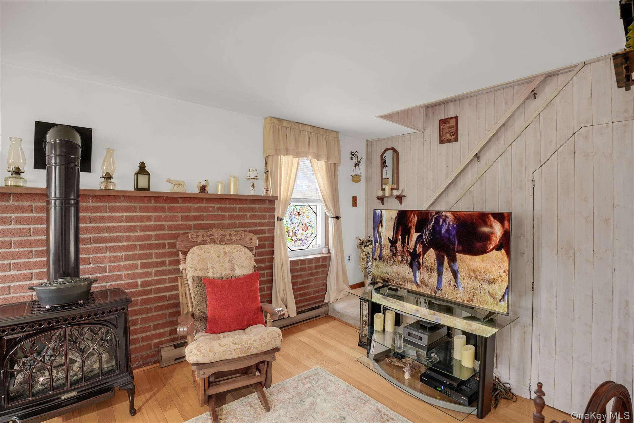 103 Wauwepex Trail Ridge, NY 11961 - Photo 6 of 25 a living room with furniture and a flat screen tv