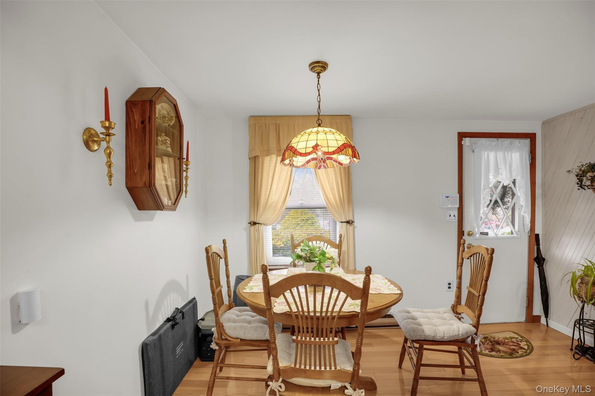 103 Wauwepex Trail Ridge, NY 11961 - Photo 10 of 25 a view of a dining room with furniture window and wooden floor