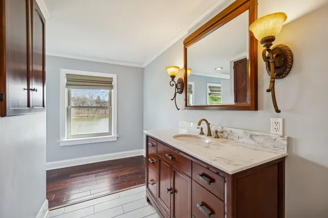 a bathroom with a sink and a mirror
