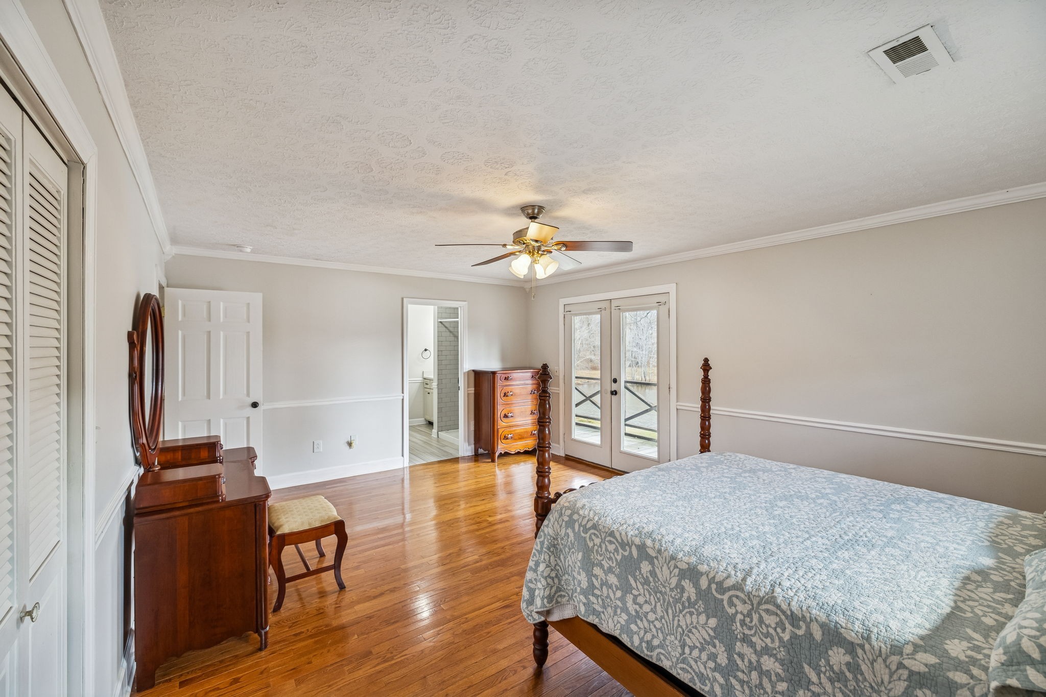 172 Littell Circle West Tracy City, TN 37387 - Photo 16 of 59 a bedroom with a bed and a chandelier