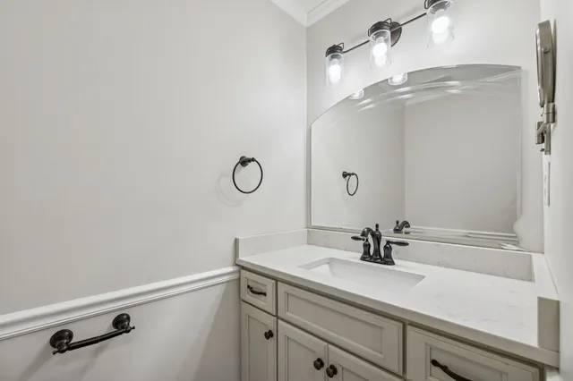 a bathroom with a sink a mirror and shower