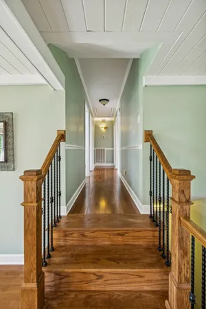 a view of hallway with furniture