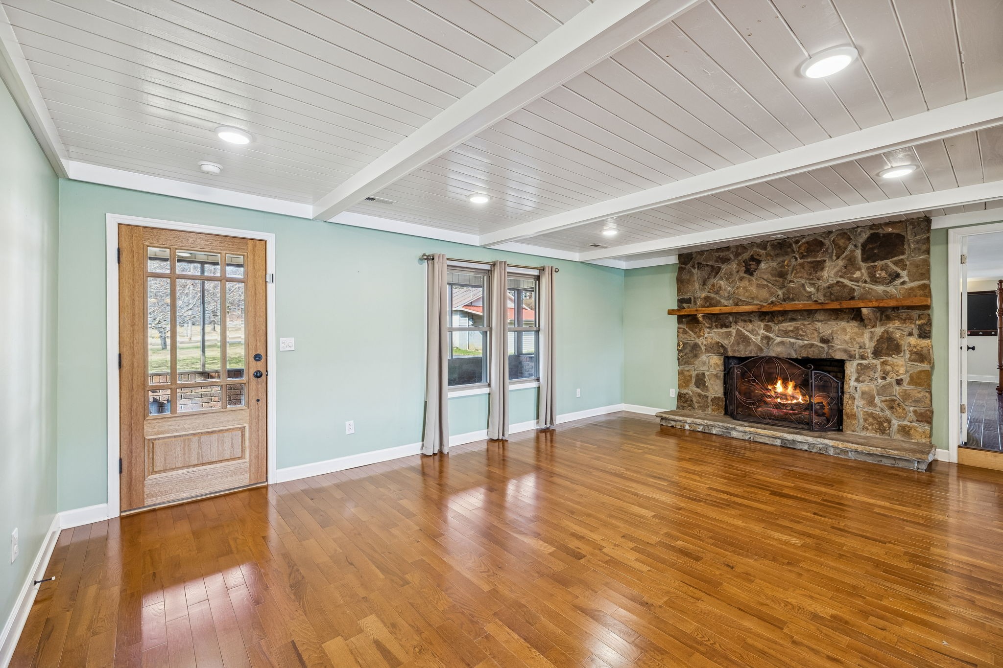 172 Littell Circle West Tracy City, TN 37387 - Photo 32 of 59 a view of an empty room with wooden floor fireplace and a window