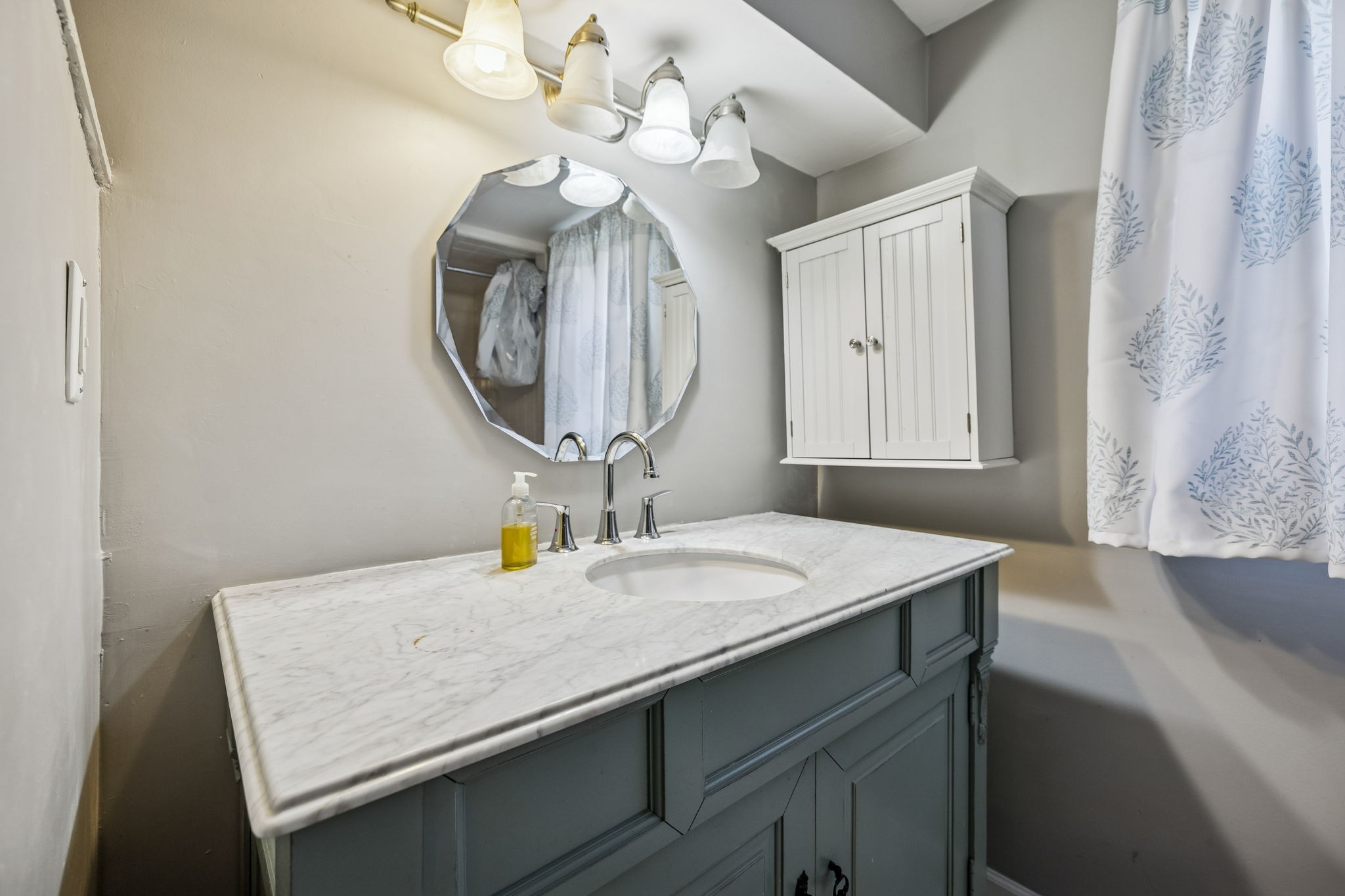 172 Littell Circle West Tracy City, TN 37387 - Photo 34 of 59 a bathroom with a sink a vanity and a mirror