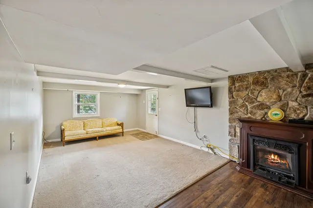 a bedroom with furniture and a fireplace