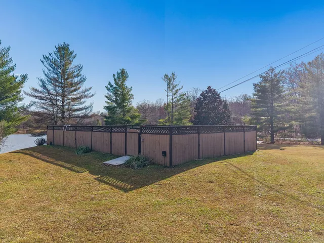 a view of a backyard of the house