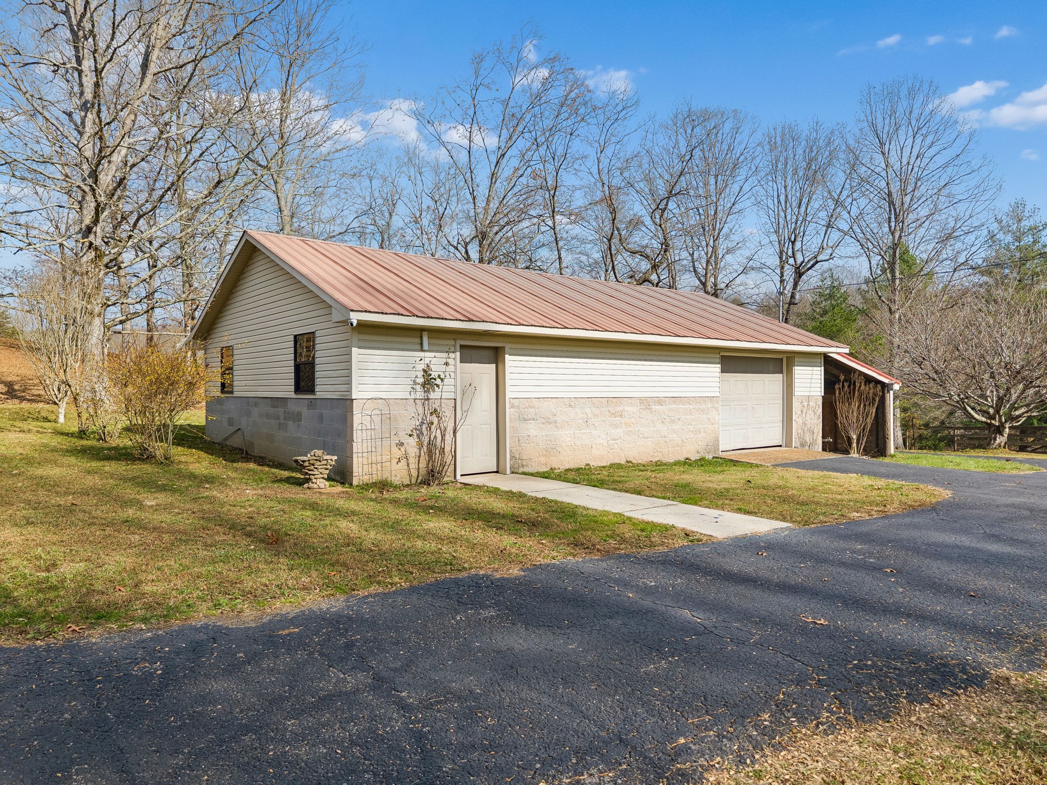 172 Littell Circle West Tracy City, TN 37387 - Photo 55 of 59 a front view of a house with a yard and garage