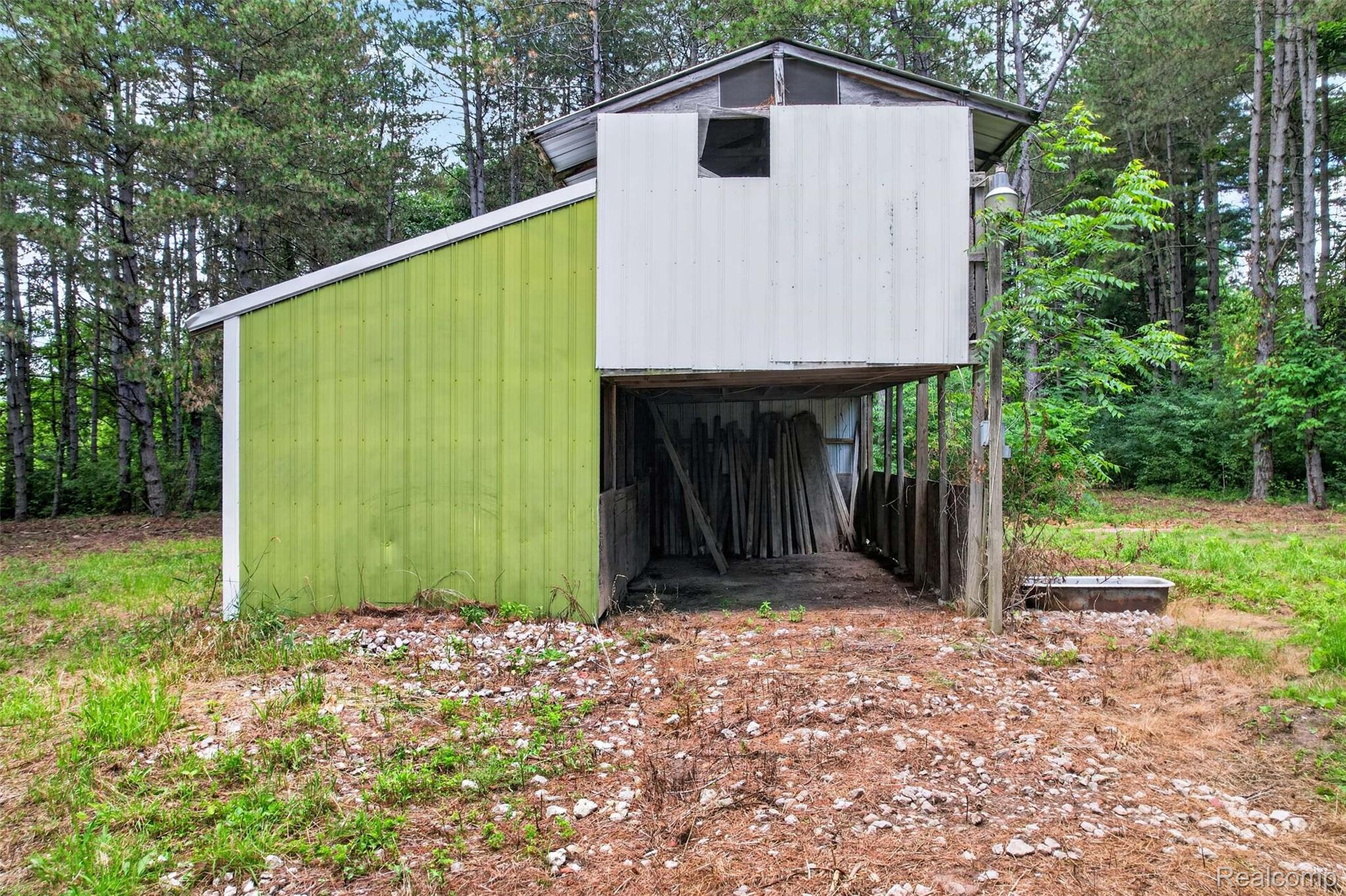 1437 East Cook Road Grand Blanc, MI 48439 - Photo 20 of 69 Two-tone outbuilding featuring a green board-and-batten side and a white metal-sided upper structure